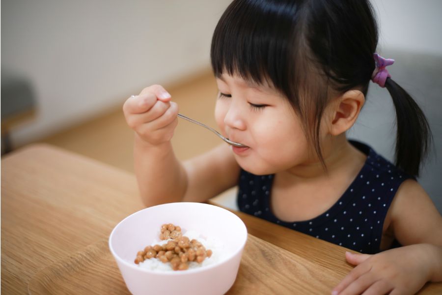 girl eating from a bowl