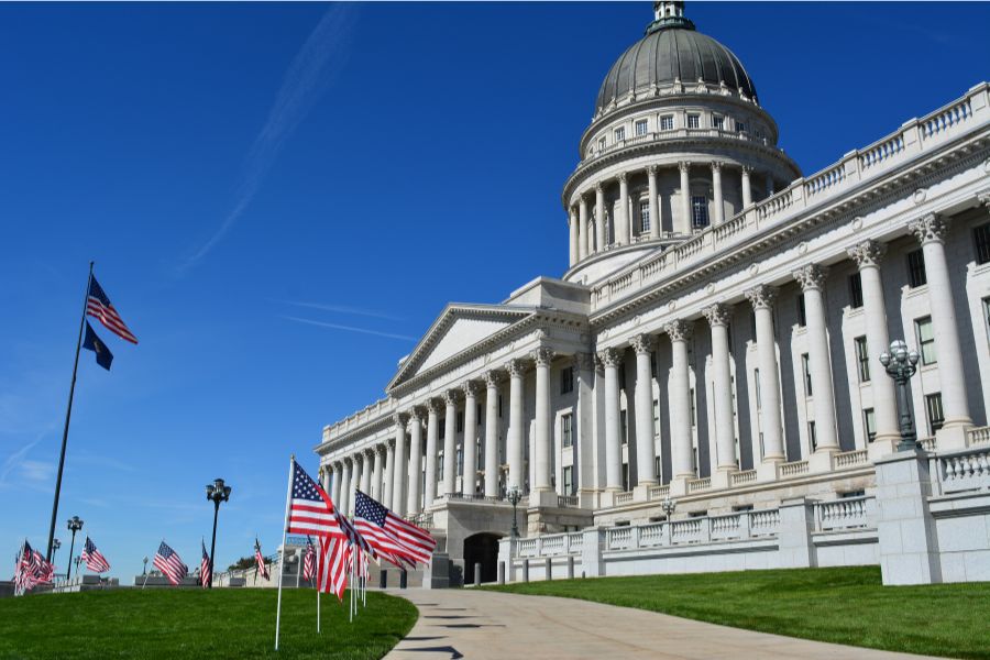 walkway lined with American flags to the US Capitol